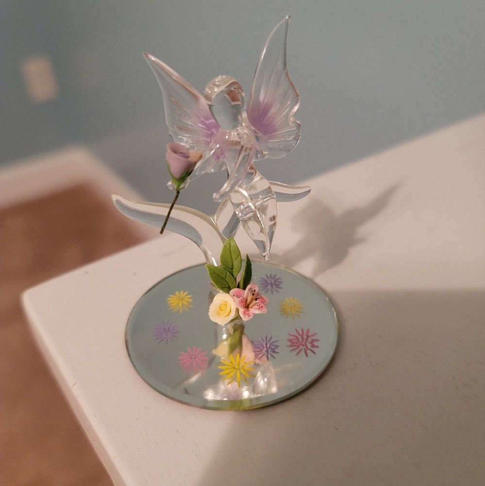 Baron Glass Fairy holding a purple rose